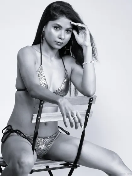 A black and white close-up of a model in a bikini, creating a timeless and classic swimwear shot.