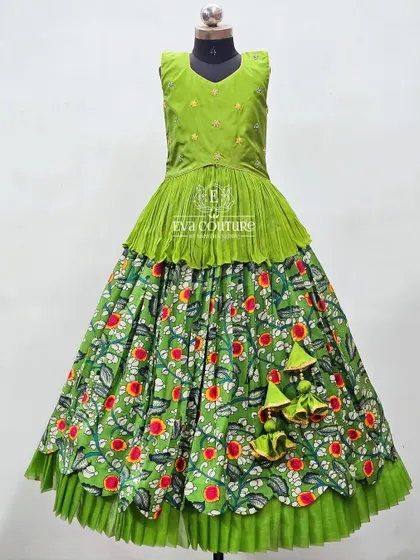 A full view of the green Kalamkari lehenga, showing the double ruffle at the hem.