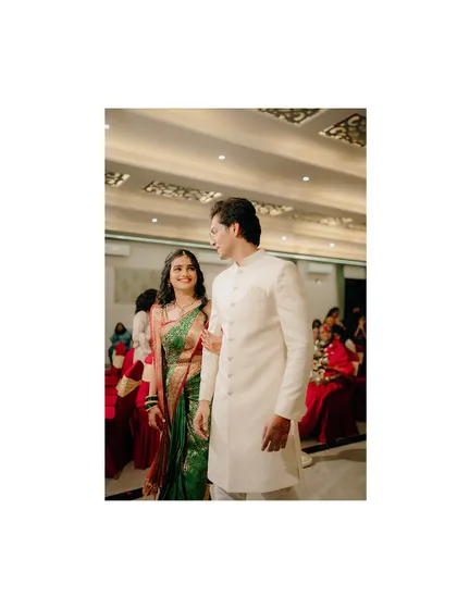 A candid shot of the newly engaged couple making their entrance. The groom's look of admiration for his bride is what makes this photo special.
