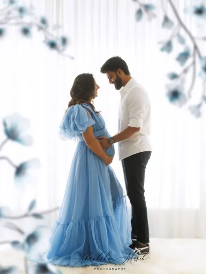 Awaiting a new beginning in a loving embrace. This ethereal maternity portrait captures the quiet, intimate connection between partners during this beautiful journey.