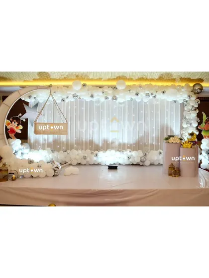 An elegant all-white fairy theme with a moon cradle.
