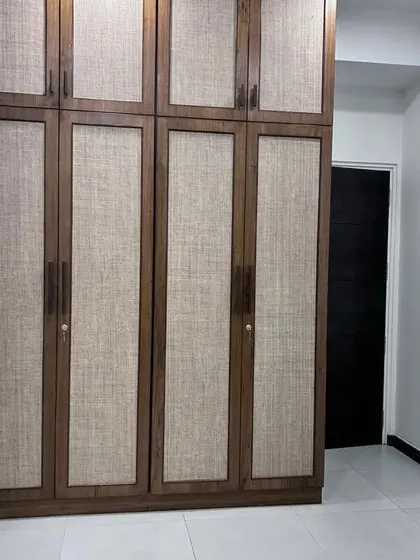 A full view of the wardrobe with the textured laminate doors. This design provides a sophisticated and understated look while offering plenty of storage.