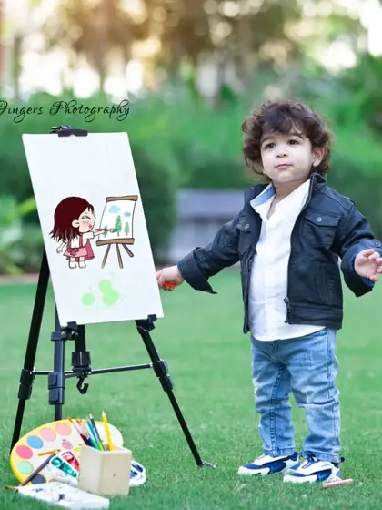 A cool little dude with his easel. Themed photoshoots are a great way to capture the unique style and personality of your growing toddler.