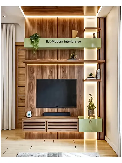 I love adding a little color to my designs. Here, a soft green accent on the shelves and cabinets contrasts beautifully with the rich wood paneling. The side-lit shelving is perfect for highlighting small plants and decor.