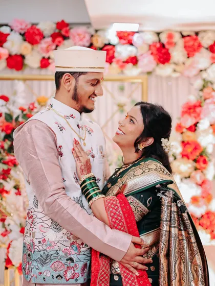 A beautiful candid photo of an engaged couple looking at each other with love.