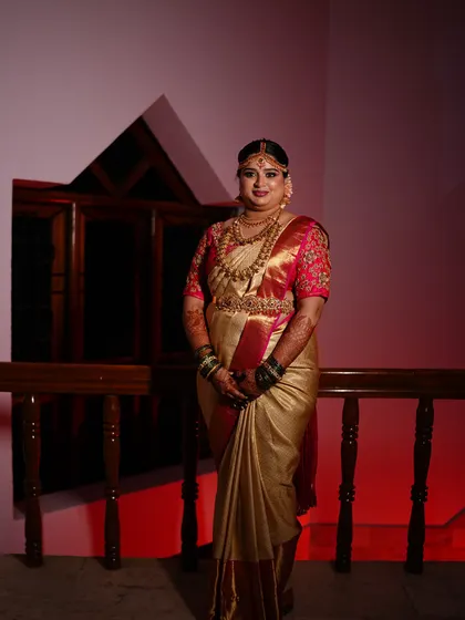 A full-length portrait of Aishwarya. Her posture and the perfect saree draping, combined with the makeup, create a look of pure grace.