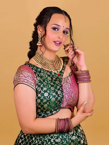 Another expressive pose, demonstrating the versatility of the makeup for different moods and shots required in a photoshoot.