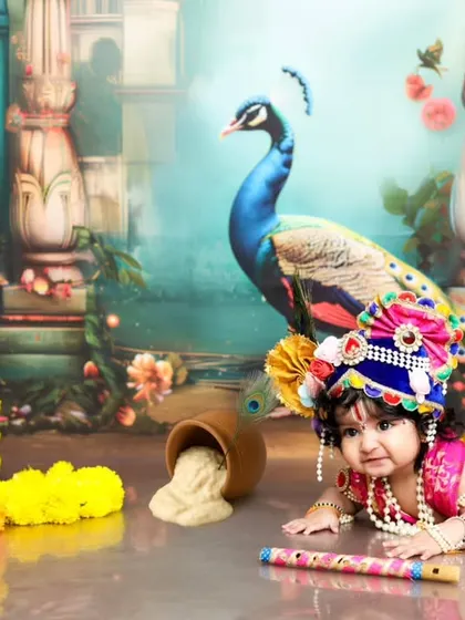 A beautiful portrait of our little Krishna, lying down with his flute. The backdrop of Vrindavan, complete with a peacock and cow, adds a magical touch.