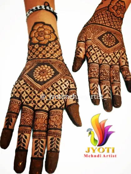 A beautiful back-of-hand design completed as part of a group booking. The "team work" text highlights our collaborative approach.