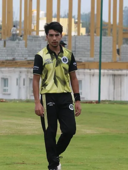 A player walks on the field, focused on his role in the game.