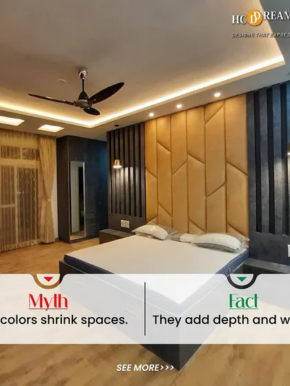 This image debunks the myth that dark colors shrink spaces. Here, a dramatic accent wall in shades of dark blue and gold adds depth, warmth, and a touch of moody sophistication to the bedroom.
