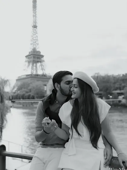 A classic black and white portrait of Meet and Tisha in Paris. This timeless style emphasizes their joyful connection and the romantic atmosphere of the city.