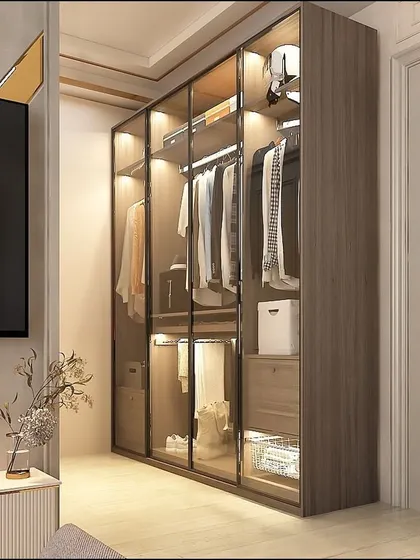 A closer look at our glass shutter wardrobe, integrated seamlessly next to a TV unit. The design ensures the room feels cohesive, with storage that is both a feature and a functional asset.