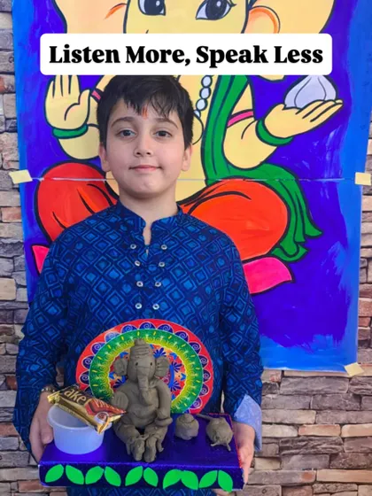 A student with his Ganesha creation, reminding us of the teaching to "Listen More, Speak Less."