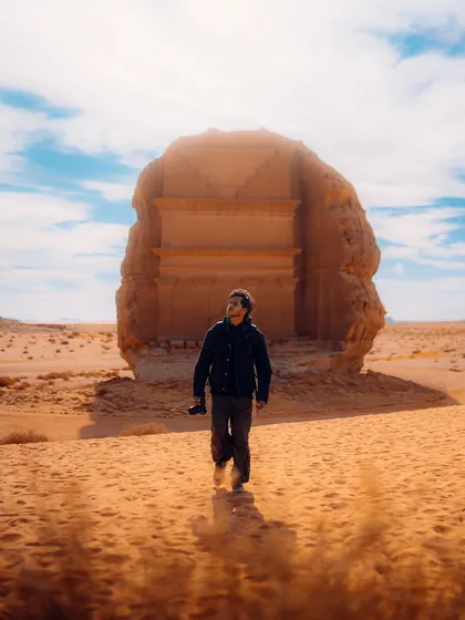 A shot of me exploring the ancient site of Hegra in Saudi Arabia. Including a human element helps viewers imagine themselves in the location, making the content more relatable and inspiring for travel.
