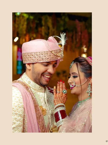 A happy, candid moment between the bride and groom during their wedding ceremony.