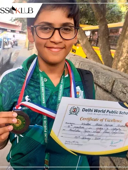 A close-up of Ahaan with his medal and Certificate of Excellence, celebrating his 1st position in the under-13 category.