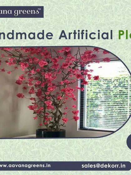 This handmade artificial plant with delicate pink flowers is perfect for adding a touch of beauty to a corner. It's a great way to bring nature indoors without any of the hassle.