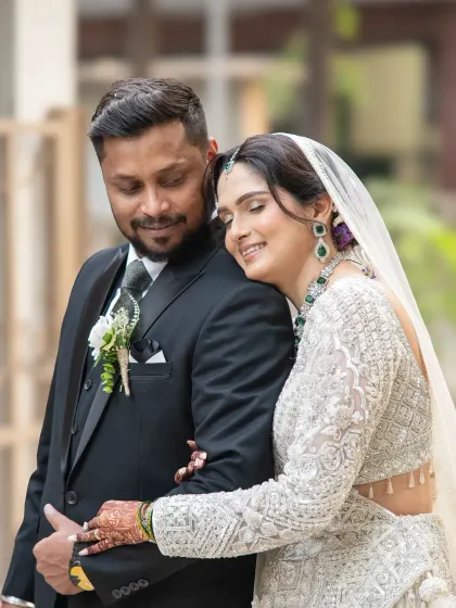 A close, tender moment between the bride and groom. This photo beautifully captures the emotion and intimacy of their wedding day.