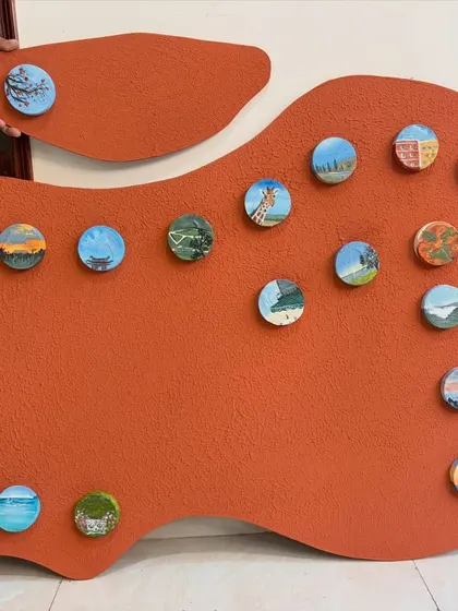 Another view of the complete "Our Memories" travel art piece, showcasing the variety of landscapes and moments captured in the miniatures.