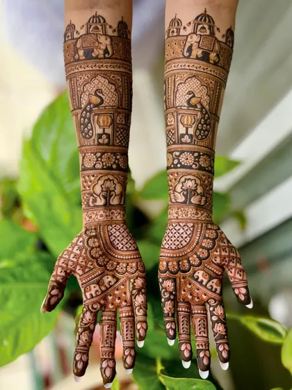 A full-length view of a traditional bridal mehendi, rich with motifs like elephants, peacocks, and the tree of life.