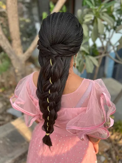 The full back view of the mermaid braid, showing its length and the beautiful way it tapers down. This is a true statement hairstyle.