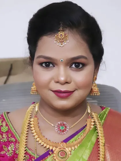 Another angle of Pallavi's baby shower makeup, showing the beautiful blend of colors on the eyes and the flawless finish of the skin.