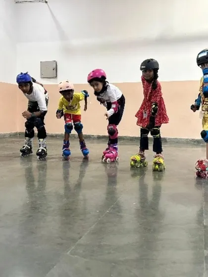 Our skating sessions are designed to teach balance, coordination, and perseverance. In this image, a group of young skaters gets ready for their lesson, fully equipped with safety gear, demonstrating our commitment to providing a secure and encouraging environment for learning new sports.