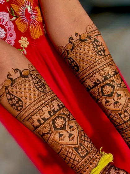 A detailed look at the forearm art for the dancing couple design. I've included classic motifs like peacocks, elephants, and lotus flowers to complement the central story.