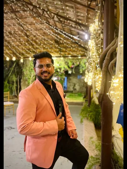 A smile is the best way to light up a room. Posing in a pink blazer, ready for a fun night.