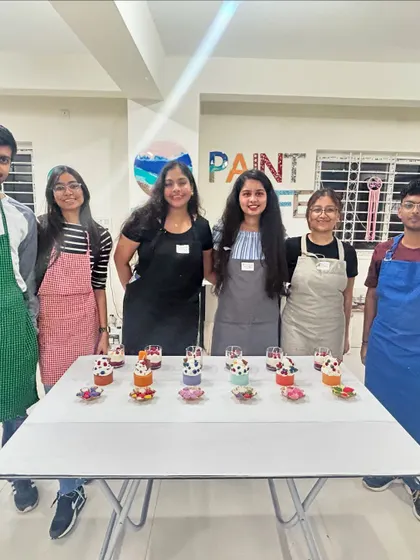 A small group at our Paint Cafe studio proudly presents their finished dessert candles. Our studio is a great venue for more intimate team workshops.