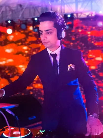 From techno to desi, my work is truly globetrotting. This picture from a wedding in Thailand captures me in my element, suited up and ready to play for an international crowd.