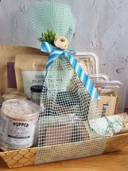 This Father's Day hamper is filled with a generous selection of snacks, including our popped mini crackers and other savory delights, all beautifully wrapped and ready for gifting.