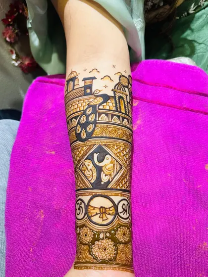 The full arm band, with the peacock motif, elephant figures, and auspicious symbols.