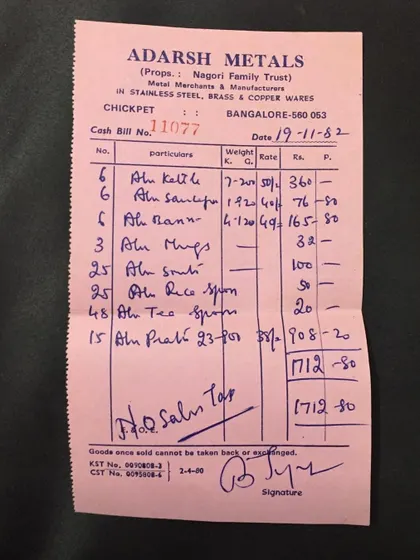 A cash bill from Adarsh Metals in 1982, detailing the purchase of aluminum kettles, spoons, and plates. This shows our long-standing investment in quality equipment for our services.