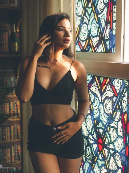 Light can be a powerful tool. Here, I used the dramatic light from a stained-glass window to sculpt the subject and create a portrait that is both bold and enigmatic, blending sensuality with art.