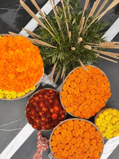 Baskets of colorful marigolds, a testament to the fresh and abundant florals I use for traditional events.
