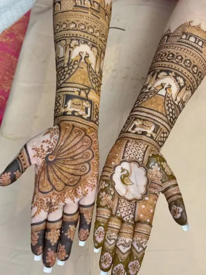 A unique take on the peacock theme, with one hand featuring a full peacock tail and the other a more abstract floral pattern. This asymmetrical design is perfect for a modern bride.
