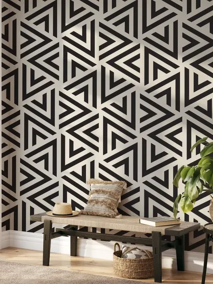 Our Repeating Stripes Triangles wallpaper adds a bold and modern touch to this entryway. The black and white geometric pattern is a timeless choice for a contemporary home.