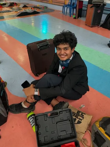A quick break between rounds. Even amidst the pressure of a competition, you can't miss that happy smile. It's about the journey, the friends you make, and the fun you have along the way.