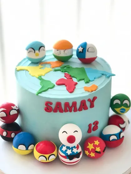 Another view of the unique "country balls" cake, showing the colorful and creative character designs.