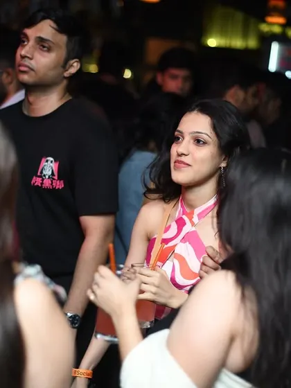 A candid moment between friends on the dancefloor.