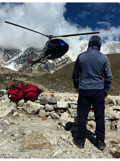 A helicopter waits to transport climbers and gear in the Khumbu region. We offer helicopter return options for our EBC treks, providing a comfortable and scenic conclusion to an epic adventure.