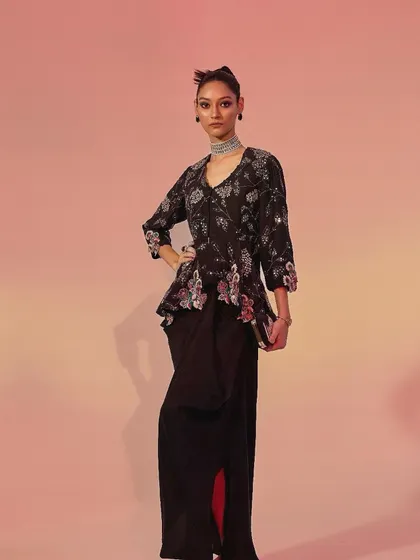 For Ose Label, I styled this contemporary Indian outfit, featuring a floral peplum top and a draped skirt. The lookbook shot uses a simple, color-gradient background to emphasize the modern silhouette and intricate detailing of the ensemble.