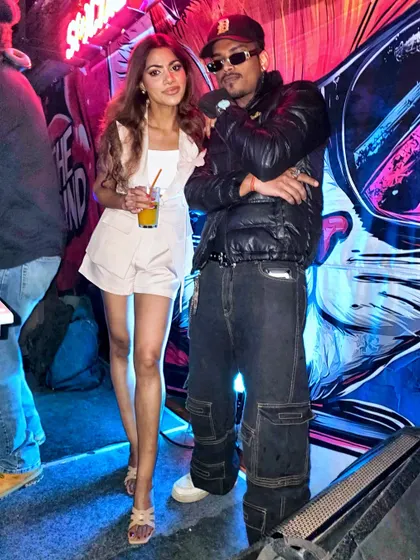 Posing with a friend at The Grind. It's a place to see and be seen, a hub for the culture.