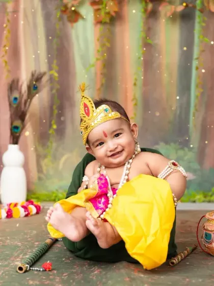 A heart-melting smile from our little Krishna. These themed sessions are filled with joy and cultural pride.