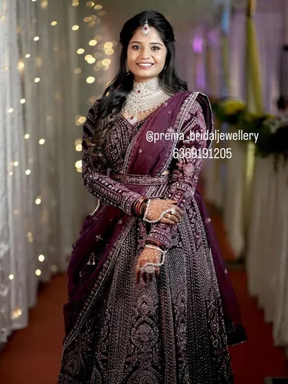 A full-length view of her gorgeous embroidered lehenga paired with my jewellery.