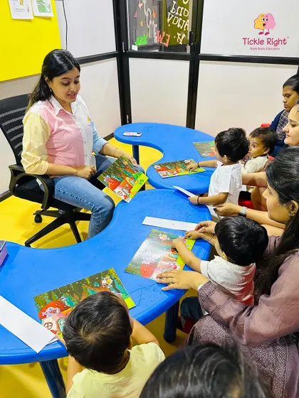 A trainer leads a group activity with puzzles, encouraging teamwork and social interaction. Our small class sizes allow for personalized guidance and a supportive learning environment.