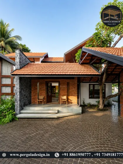 This home combines modern and traditional elements, with a tiled roof structure providing shade for the entrance. The design preserves a large tree, integrating nature directly into the architecture.