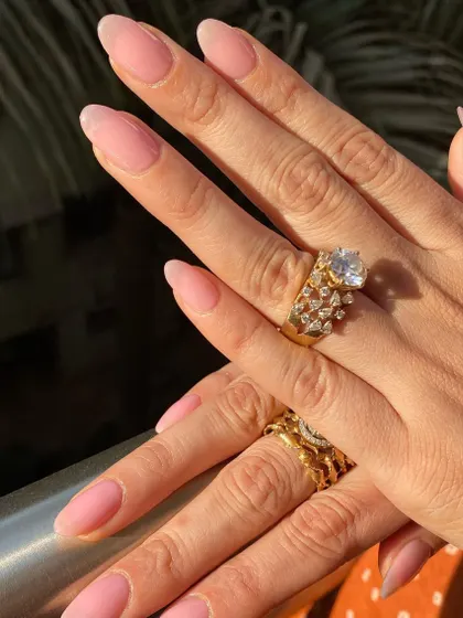 A full view of this simple and elegant sheer pink manicure.